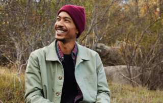 Young man smiling while enjoying a sunny day